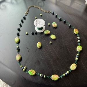 "Handcrafted Necklace Made of Green and Black Glass Beads"